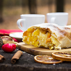 .Strudel with custard and orange. Christmas Stollen. Christmas table decoration.