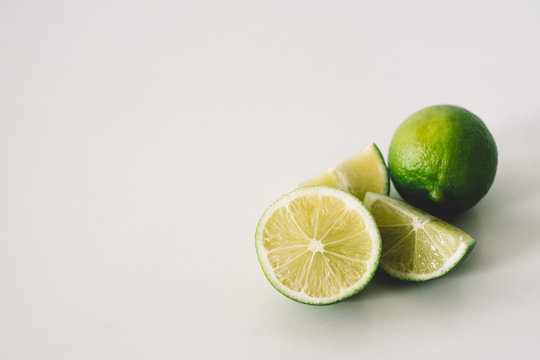 Lime and slices on a white background closeup
