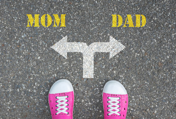 Shoes standing at the crossroad - mom or dad