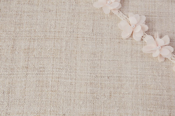 Artificial pink purple peony flowers on linen, copy space background, selective focus, vintage tone