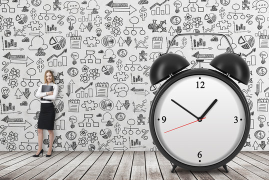 A huge alarm clock on the front view and there is a business lady with black document file. Business icons are drawn on the concrete.