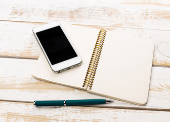 Opened notebook and other office equipment