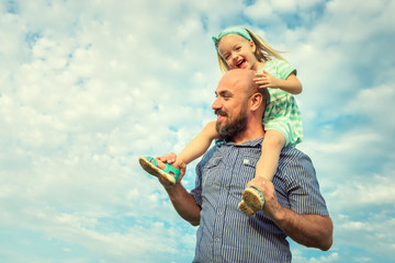 Adorable daughter and father portrait, happy family, future concept
