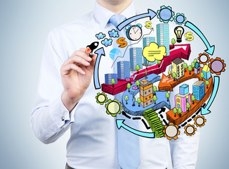 A businessman is drawing a colourful city development flowchart on the glass screen. A colourful...