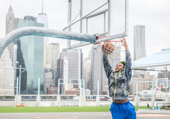 Fototapeta premium Basketball player making a slam dunk