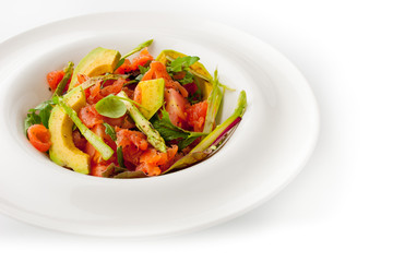 Vegetable salad with trout on the white background