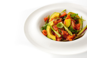 Avocado and trout salad on the white  plate