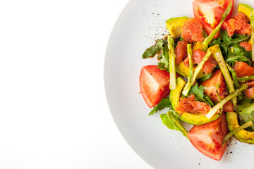 Vegetable salad with trout and asparagus on the white background top view