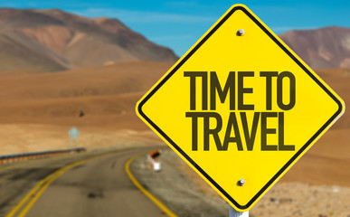 Time To Travel sign on desert road