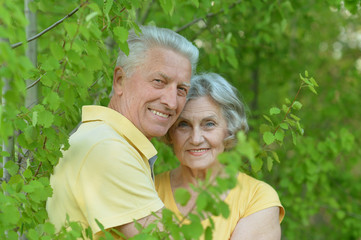 Mature couple on  walk  in summer