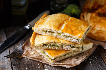 Homemade pie stuffed with chicken ang broccoli
