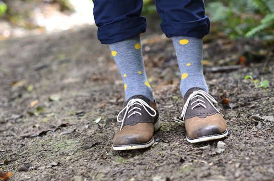 Young man's legs wearing polka dot socks