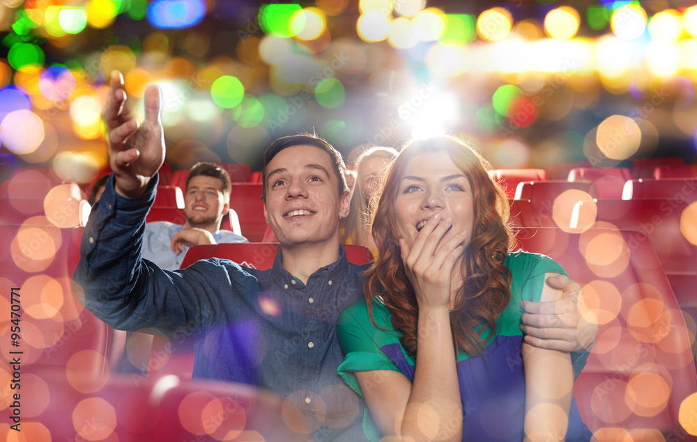 Wall mural happy friends watching movie in theater