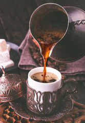 Pouring turkish coffee - obrazy, fototapety, plakaty