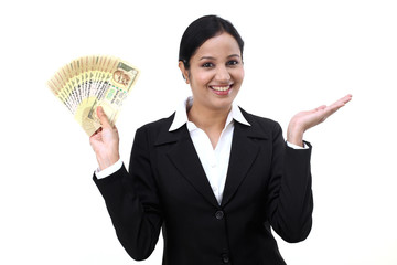 Young business woman with rupee notes in her hands