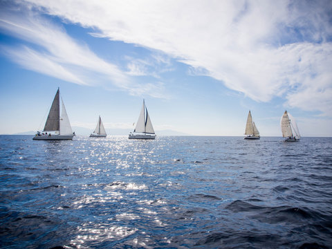Five sailboats sailing in a yacht race between Kavala and Thassos, Greece