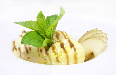 balls of ice cream with fruit and caramel sauce