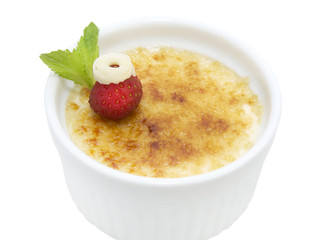 portion of the cream brulee on a white background
