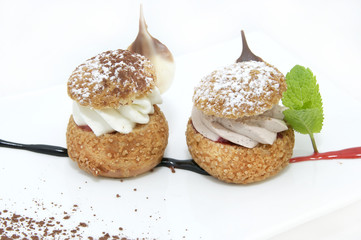profiteroles with vanilla ice cream decorated with chocolate mint