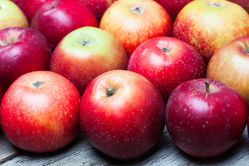 Fototapeta na wymiar Red apples on wooden board.