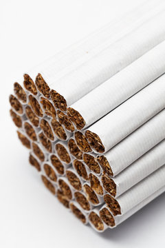 Closeup of tobacco cigarettes on white background.