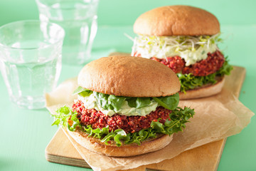 veggie beet and quinoa burger with avocado dressing