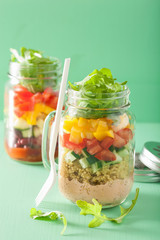 vegan quinoa bean vegetable salad in mason jars