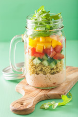 vegan quinoa vegetable salad in mason jars