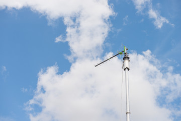 Fototapeta na wymiar Digital televisions antennas with cloudy sky background.