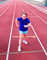 Little girl have fun on the stadium