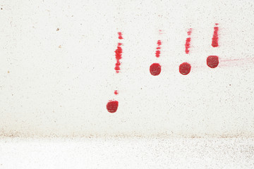 Exclamation mark. Brushstroke with red paint  on dusty metal fence