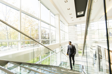 Young black man walking in the office