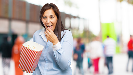 happy young woman with popcorn