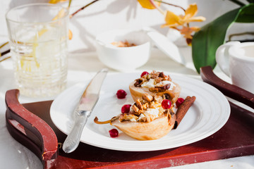 Baked pears with ricotta, walnuts, honey and cranberries,horizon