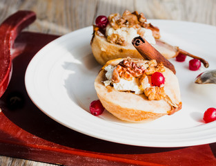 Baked pears with ricotta, walnuts, honey and cranberries,closeup
