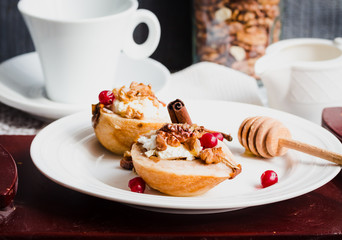 Baked pears with ricotta, walnuts, honey and cranberries