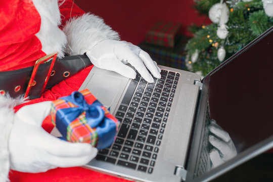 Santa buying gift by online payment through the Internet Banking