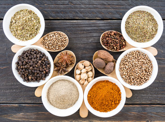 Spices and herbs in  bowls.