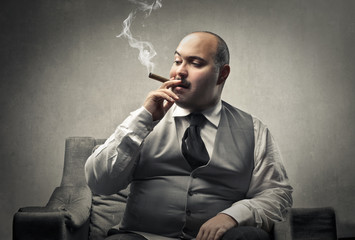 Fat man smoking a cigar - obrazy, fototapety, plakaty