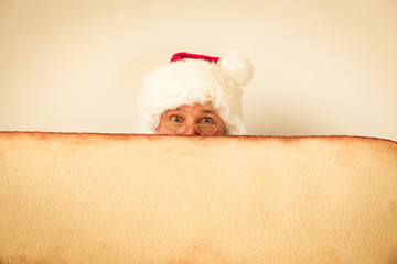 Santa Claus holding scroll paper blank