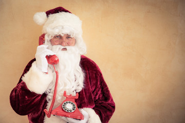 Fototapeta na wymiar Santa Claus talking on phone