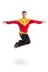 young man wearing a folk russian costume jumping against isolated white with copyspace
