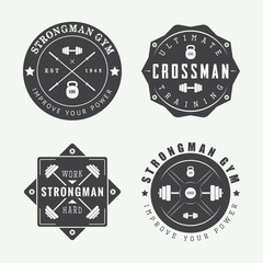 Set of gym logos, labels and slogans in vintage style. 