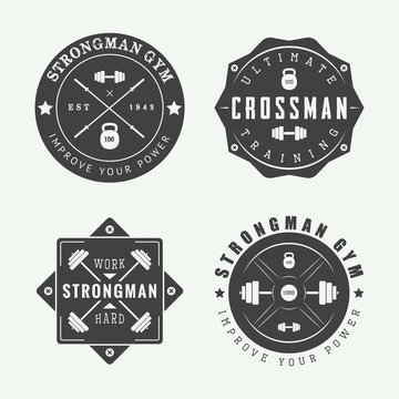 Set of gym logos, labels and slogans in vintage style. 