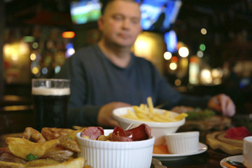 a man eats in the bar
