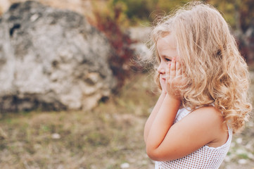 emotional child girl outdoors