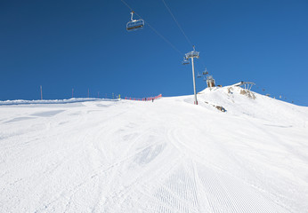 Snowy ski piste on a mountain