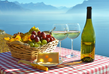 Wine and grapes against vineyards in Lavaux, Switzerland © HappyAlex