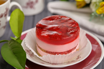 Round cake with raspberry jelly and cream. 