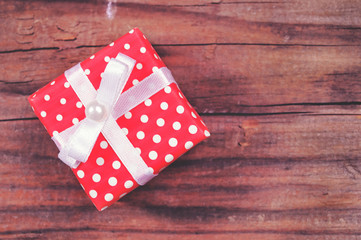 Christmas gift box on wooden background